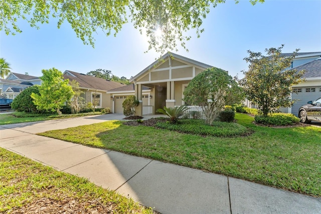 view of front of house featuring stucco siding, concrete driveway, a garage, and a front lawn