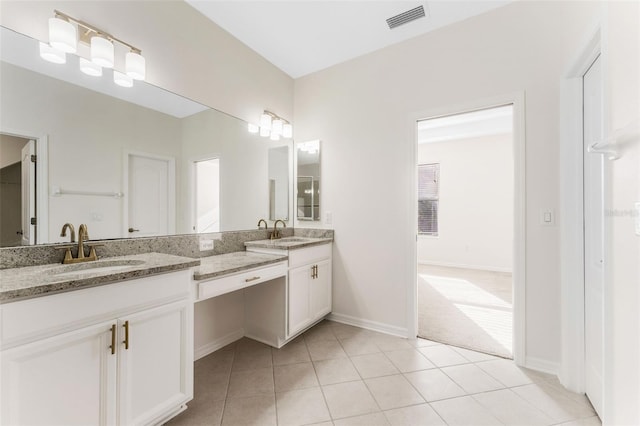 full bathroom featuring tile patterned flooring, double vanity, visible vents, and a sink