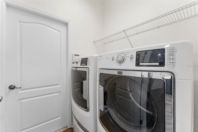 laundry area featuring laundry area and washing machine and clothes dryer