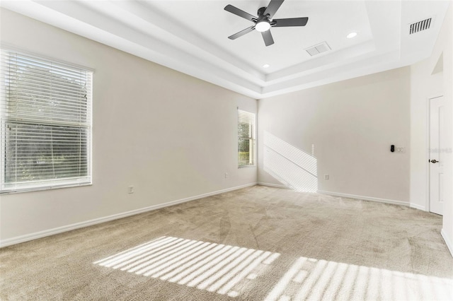 unfurnished room featuring ceiling fan, baseboards, visible vents, and carpet floors