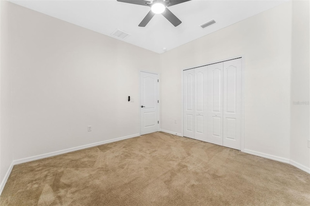 unfurnished bedroom featuring visible vents, baseboards, and carpet floors