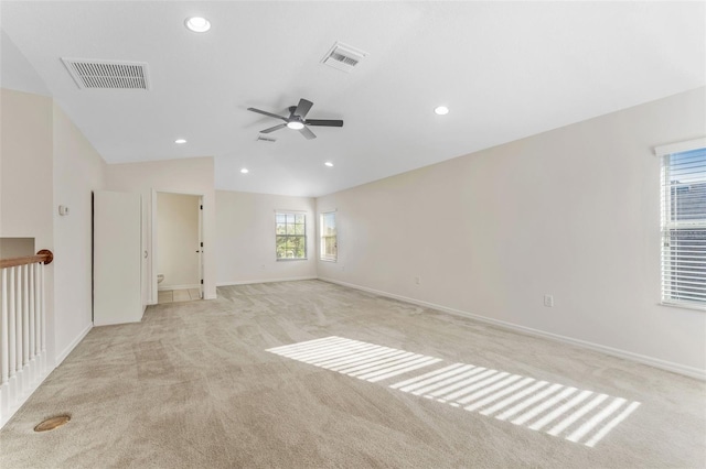 empty room with visible vents, recessed lighting, a ceiling fan, and light carpet