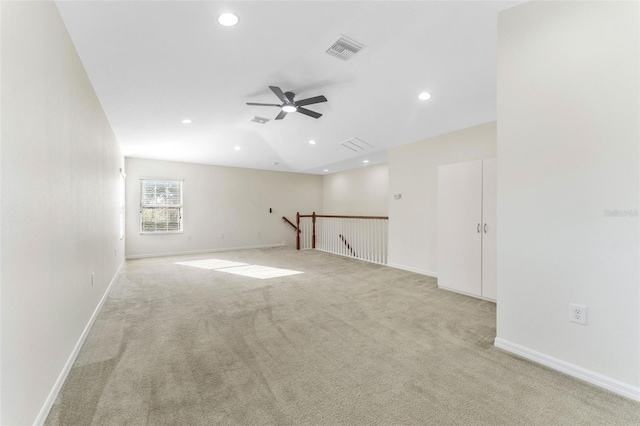 unfurnished room featuring carpet flooring, a ceiling fan, visible vents, and recessed lighting