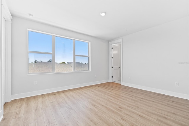 11 29th St N, Saint Petersburg, FL 33713 - unfurnished room with light wood-style floors and baseboards