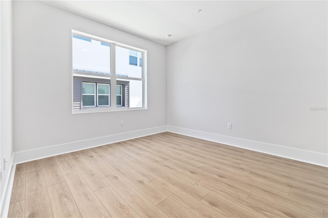 11 29th St N, Saint Petersburg, FL 33713 - spare room with light wood-style floors and baseboards