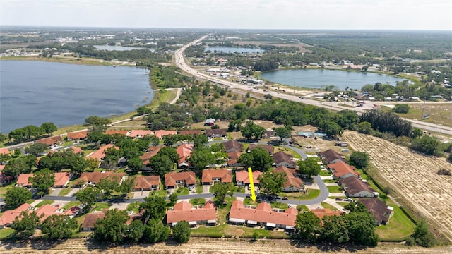 bird's eye view featuring a water view and a residential view