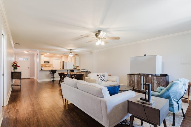 living area featuring dark wood-style flooring, ceiling fan, baseboards, ornamental molding, and visible vents