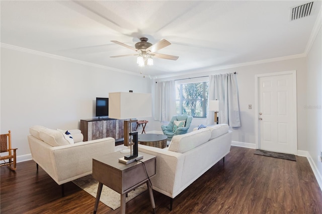 living room featuring dark wood-style floors, visible vents, ornamental molding, baseboards, and ceiling fan