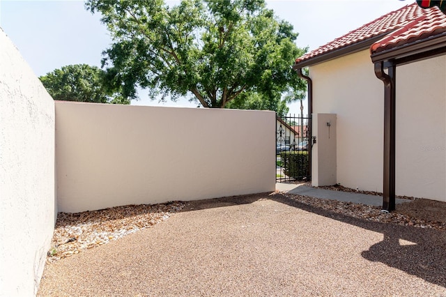 view of patio featuring a gate and fence