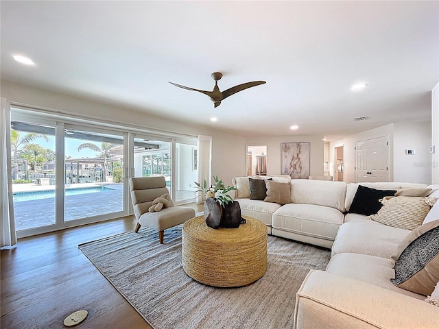 living area featuring recessed lighting, ceiling fan, and wood finished floors