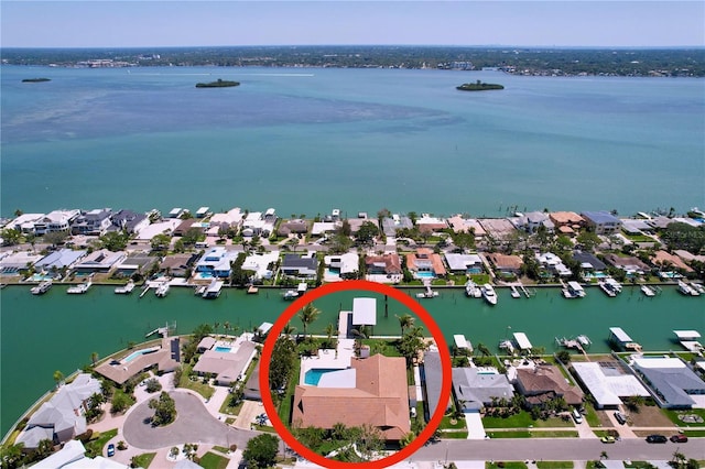 drone / aerial view featuring a residential view and a water view