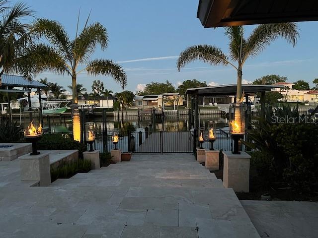 773 Snug Is, Clearwater Beach, FL 33767 - gate featuring boat lift and a water view