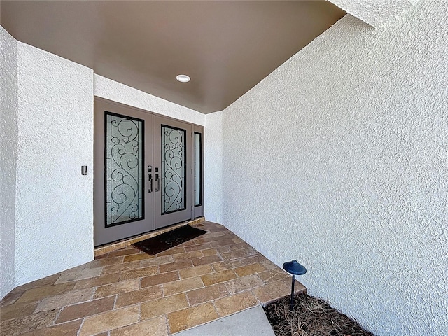 773 Snug Is, Clearwater Beach, FL 33767 - entrance to property with stucco siding and french doors
