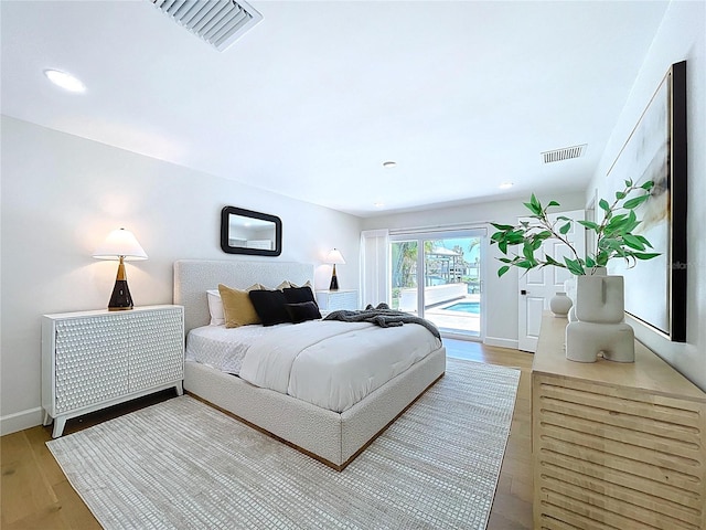 773 Snug Is, Clearwater Beach, FL 33767 - bedroom featuring access to outside, light wood-type flooring, baseboards, and recessed lighting