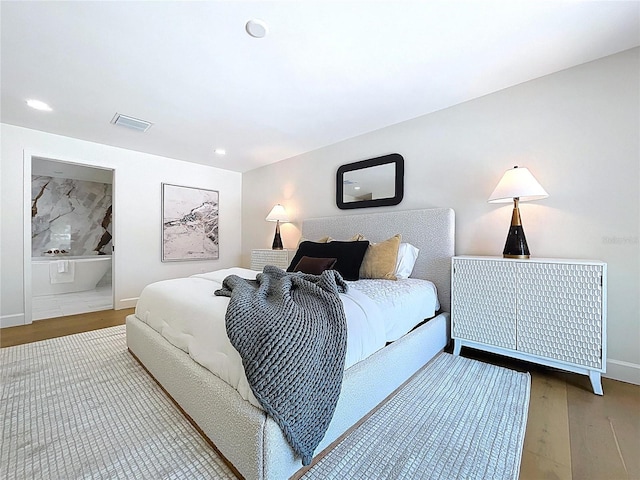 773 Snug Is, Clearwater Beach, FL 33767 - bedroom featuring wood finished floors, recessed lighting, and baseboards
