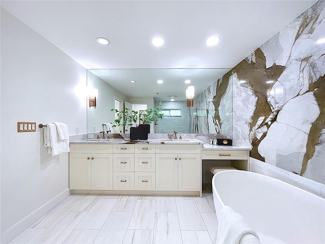 773 Snug Is, Clearwater Beach, FL 33767 - bathroom featuring a shower stall, baseboards, a freestanding tub, recessed lighting, and double vanity