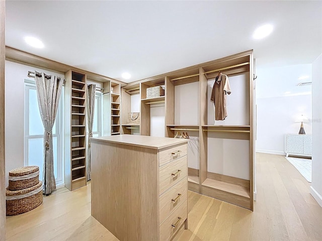 773 Snug Is, Clearwater Beach, FL 33767 - walk in closet featuring light wood finished floors