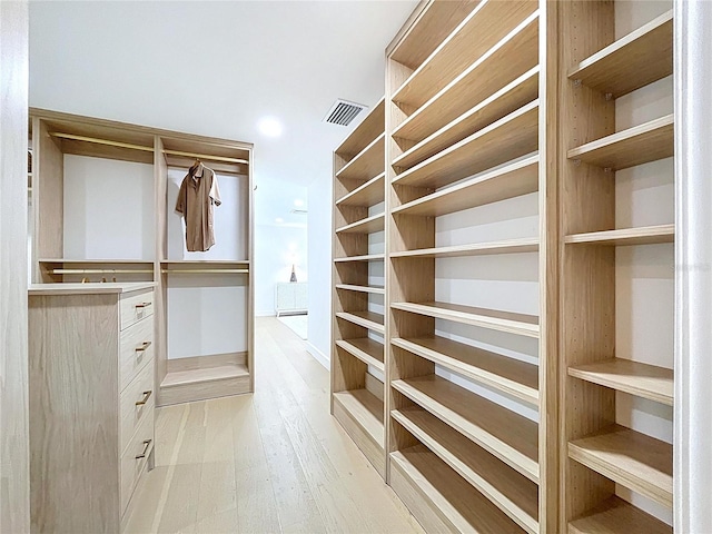 773 Snug Is, Clearwater Beach, FL 33767 - walk in closet with light wood-type flooring
