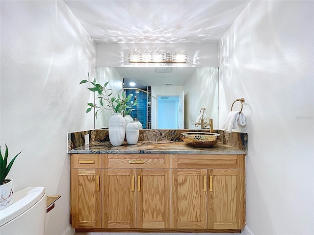773 Snug Is, Clearwater Beach, FL 33767 - bathroom featuring vanity, toilet, baseboards, and a shower with shower door