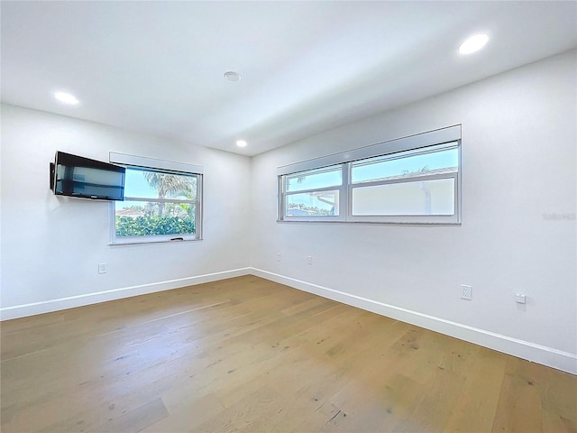 773 Snug Is, Clearwater Beach, FL 33767 - empty room with baseboards, wood finished floors, and recessed lighting