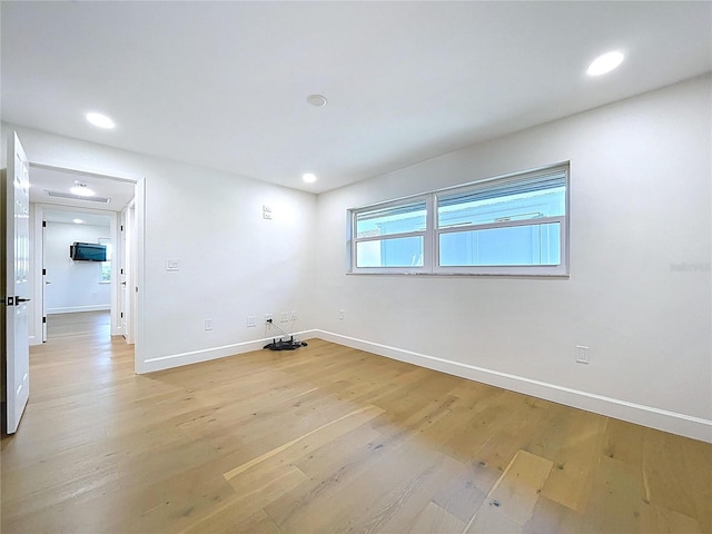 773 Snug Is, Clearwater Beach, FL 33767 - spare room featuring baseboards, light wood-type flooring, and recessed lighting