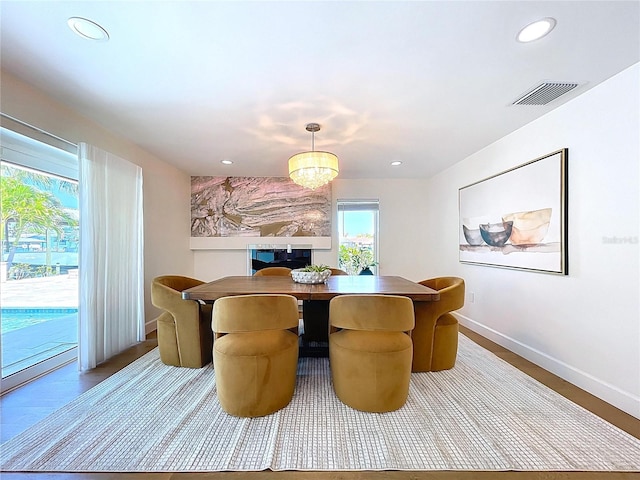 773 Snug Is, Clearwater Beach, FL 33767 - dining room with baseboards, recessed lighting, and wood finished floors