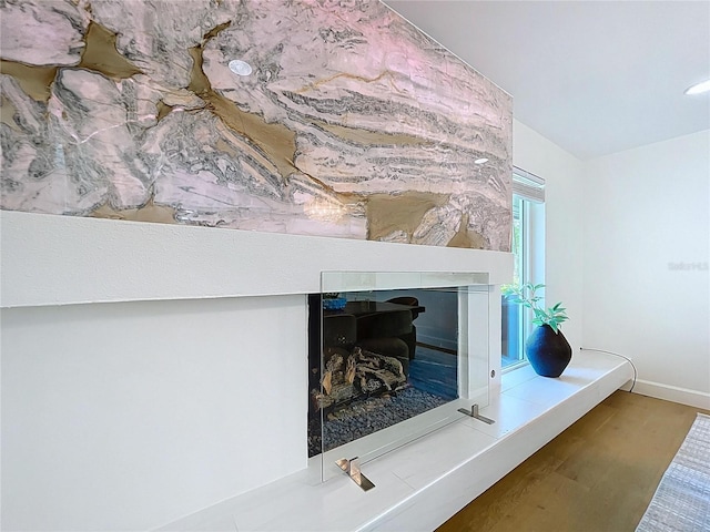773 Snug Is, Clearwater Beach, FL 33767 - detailed view of wood finished floors, baseboards, and a fireplace
