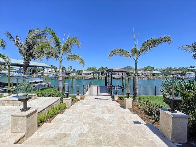 773 Snug Is, Clearwater Beach, FL 33767 - dock featuring boat lift and a water view