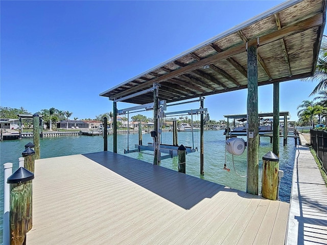 773 Snug Is, Clearwater Beach, FL 33767 - dock with boat lift and a water view