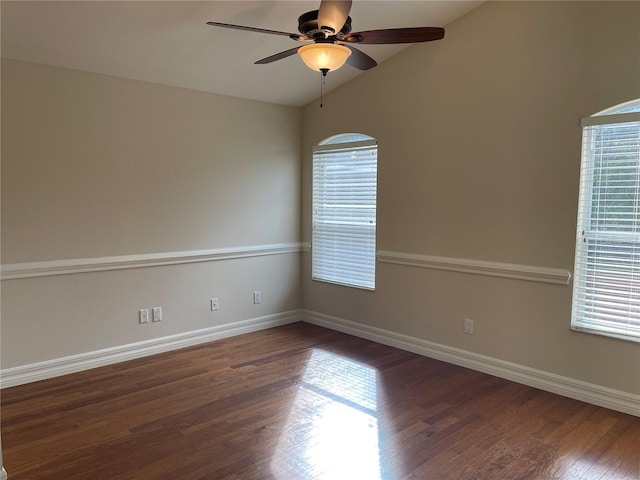 empty room with wood finished floors, ceiling fan, lofted ceiling, and a healthy amount of sunlight