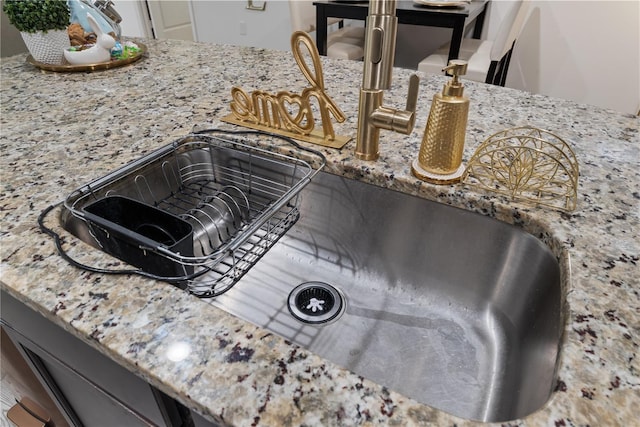 8975 Southern Charm Cir, Brooksville, FL 34613 - interior details featuring light stone countertops and a sink