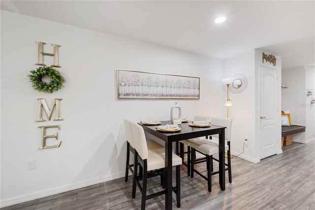 8975 Southern Charm Cir, Brooksville, FL 34613 - dining room featuring wood finished floors, recessed lighting, and baseboards