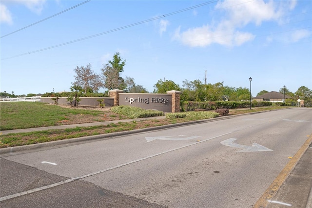 8975 Southern Charm Cir, Brooksville, FL 34613 - view of street with curbs, sidewalks, and street lights