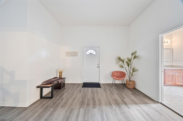 105 W Columbus Dr, Tampa, FL 33602 - foyer with light wood-style flooring and baseboards