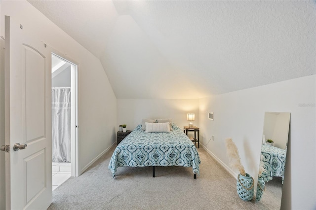 105 W Columbus Dr, Tampa, FL 33602 - carpeted bedroom with baseboards and vaulted ceiling