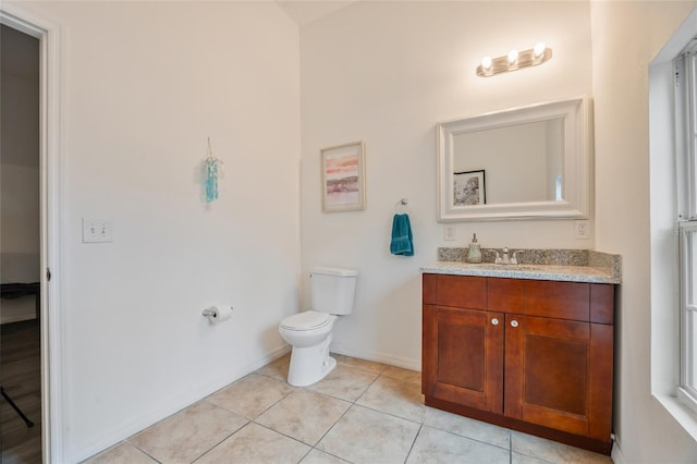 105 W Columbus Dr, Tampa, FL 33602 - bathroom with toilet, tile patterned floors, vanity, and baseboards