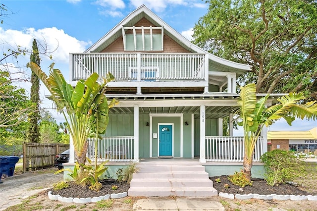 105 W Columbus Dr, Tampa, FL 33602 - view of front of home featuring a porch, a balcony, and fence