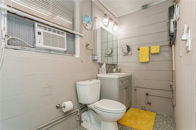 half bath featuring toilet and vanity