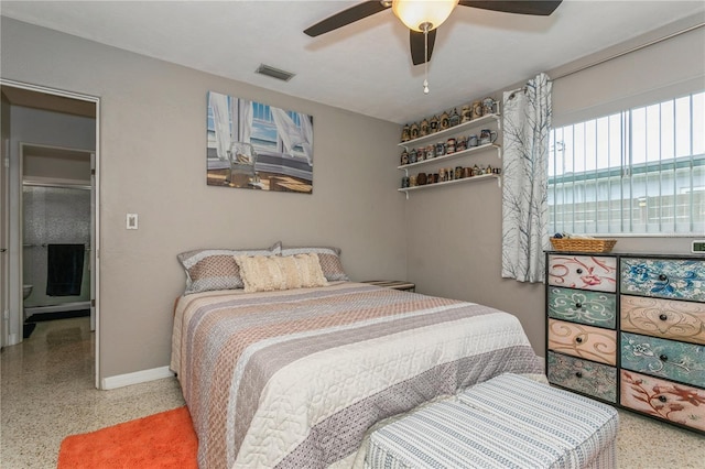 bedroom featuring visible vents, baseboards, speckled floor, and ceiling fan