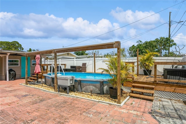 view of patio featuring a fenced in pool, a wooden deck, and fence