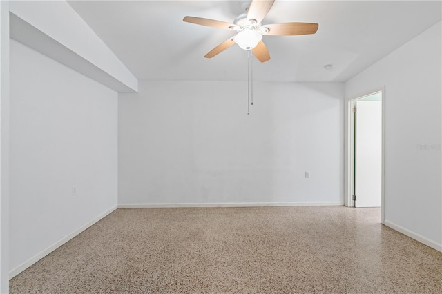 17111 Mockingbird Ln, Lutz, FL 33548 - spare room with speckled floor, ceiling fan, and baseboards