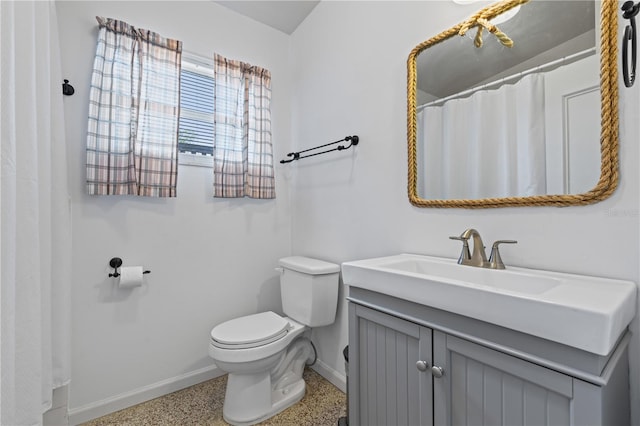 17111 Mockingbird Ln, Lutz, FL 33548 - bathroom featuring toilet, speckled floor, baseboards, and vanity