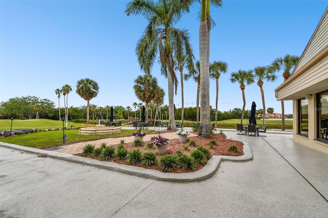view of property's community with a yard
