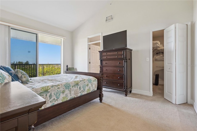 456 Bahia Beach Blvd, Ruskin, FL 33570 - bedroom featuring visible vents, baseboards, a walk in closet, access to exterior, and light carpet