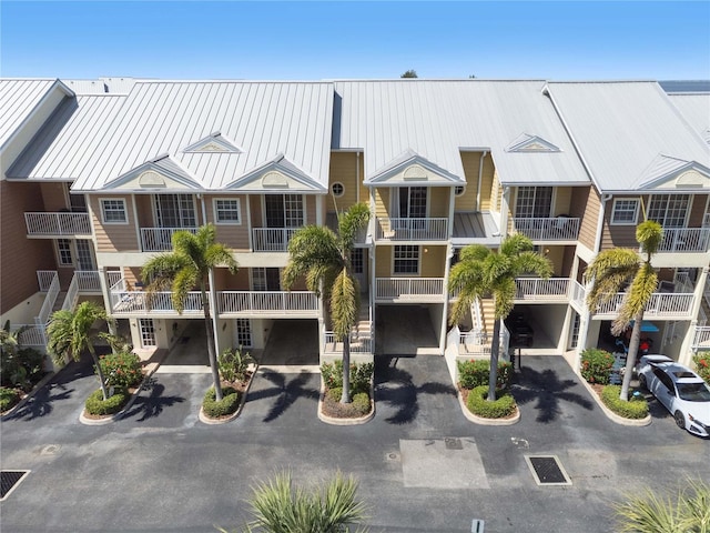 456 Bahia Beach Blvd, Ruskin, FL 33570 - view of property featuring an attached garage and aphalt driveway