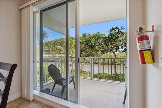 456 Bahia Beach Blvd, Ruskin, FL 33570 - doorway with baseboards and a water view