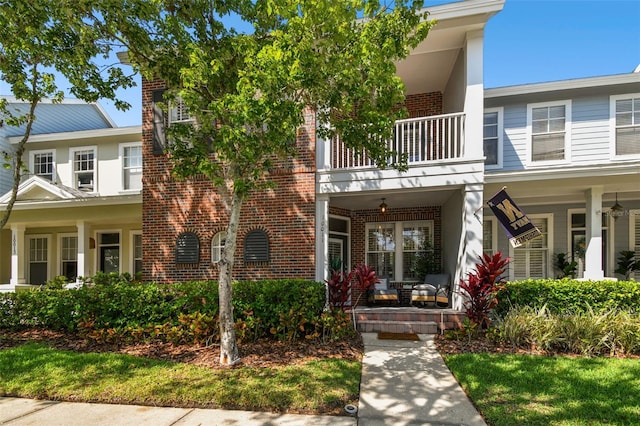 10011 Parley Dr, Tampa, FL 33626 - multi unit property with brick siding, a balcony, and covered porch