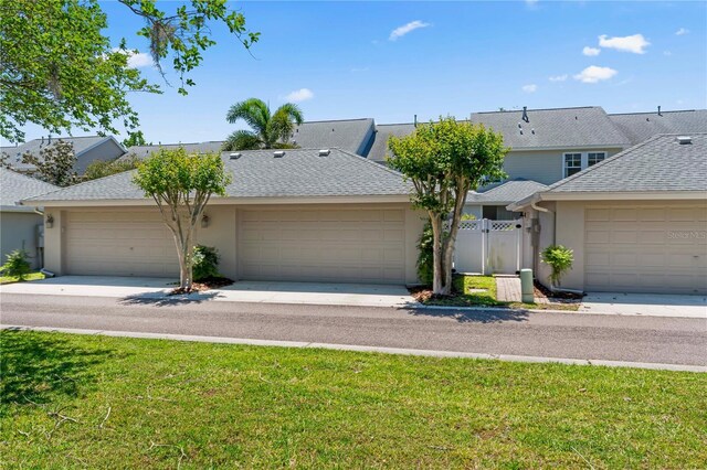 10011 Parley Dr, Tampa, FL 33626 - view of property featuring roof with shingles and stucco siding