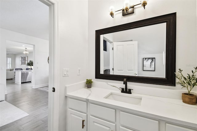 10011 Parley Dr, Tampa, FL 33626 - bathroom with vanity, baseboards, and wood finished floors