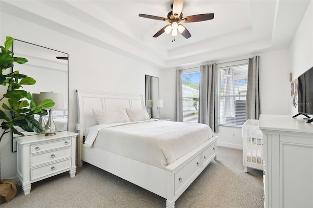 10011 Parley Dr, Tampa, FL 33626 - bedroom featuring light colored carpet, a ceiling fan, and a raised ceiling